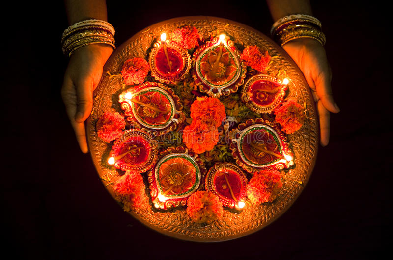 hands-holding-diwali-lamps-female-traditional-earthen-lit-up-line-festival-india-41142897